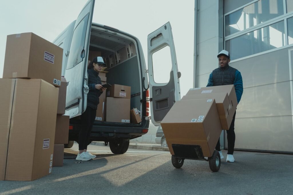 pexels photo 6169668 Two couriers load boxes into a van for shipment, showcasing logistics and teamwork.